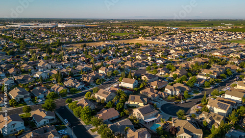 Breathtaking drone photos capture the stunning landscapes of Manteca, California, showcasing its charming houses nestled amidst picturesque surroundings.