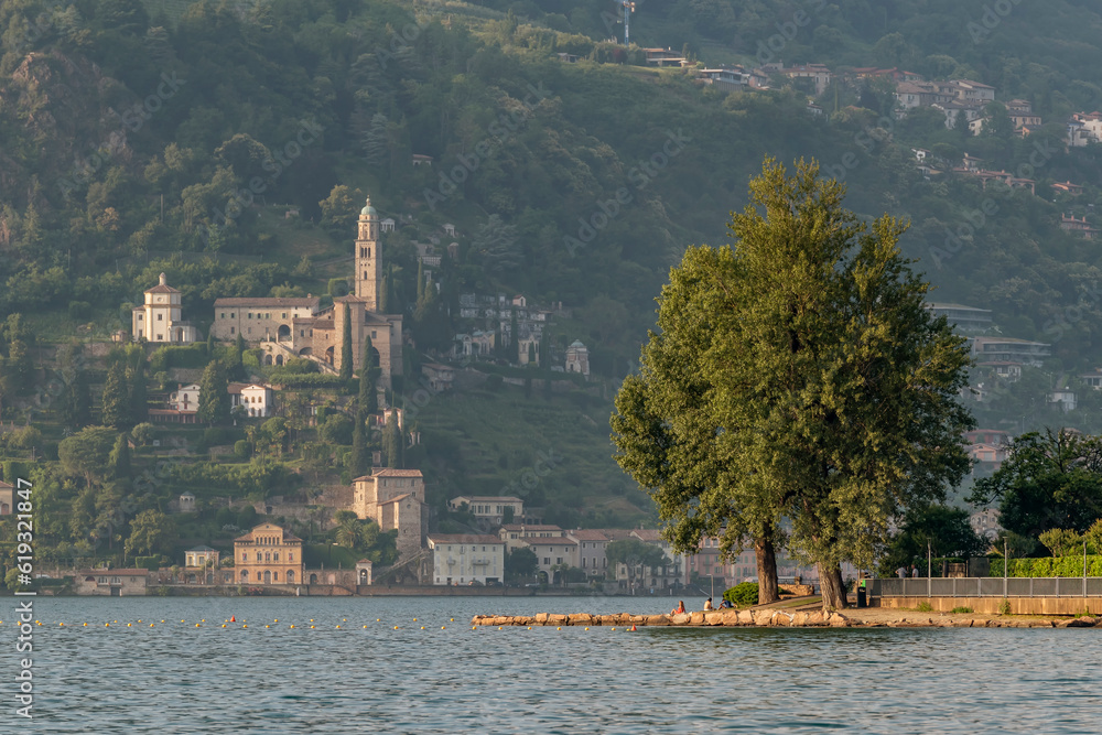 Sunset view of Lake Lugano from Porto Ceresio, Italy, with Morcote, Switzerland in the background