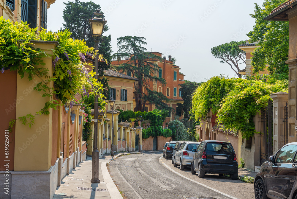 Mediterranean street in the summer with houses and green vegetation