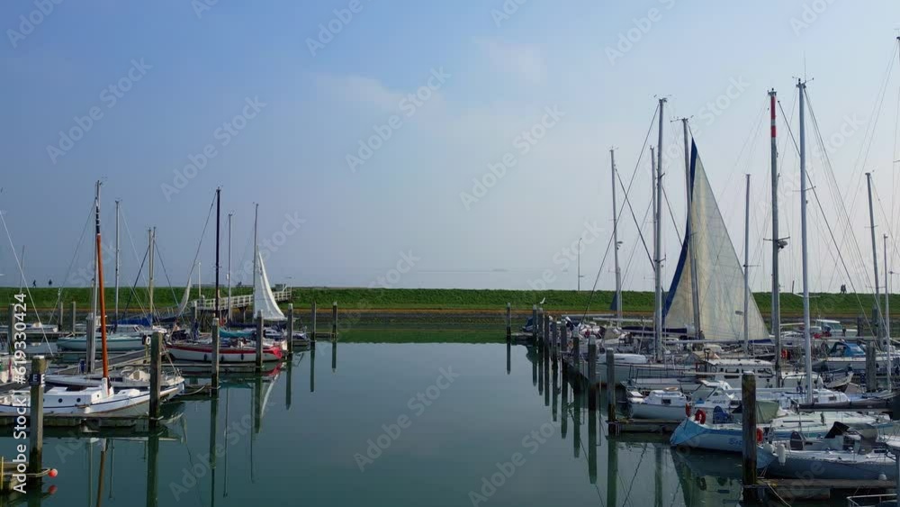 Flying towards the boats at the harbour at sunset. Capturing long shadows. Netherlands Flying towards the boats at the harbour at sunset. Capturing long shadows. Netherlands