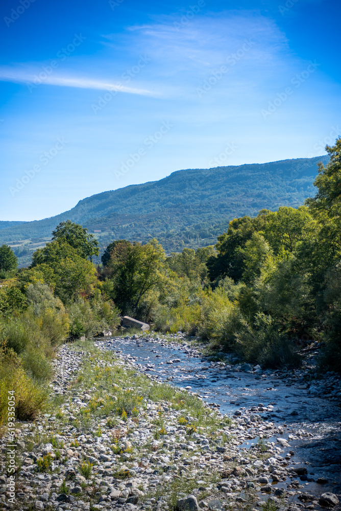 Small River in the Mountains in Italy in Summer Small River in the Mountains in Italy in Summer