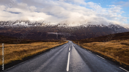 Enchanting Icelandic Landscape: Snow-Covered Mountains and Scenic Road