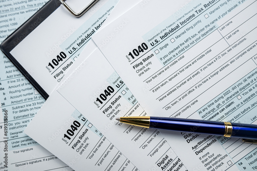 cloeup of 1040 US federal income tax return form with pen cloeup of 1040 US federal income tax return form with pen
