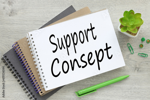 business concept. There are three notebooks on the work table near a plant in a pot with text. support consept