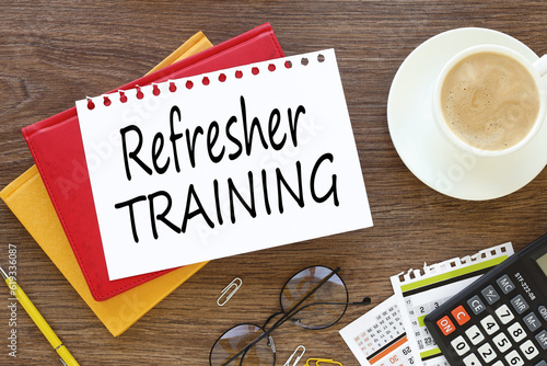 Wallpaper Mural Refresher Training business concept. On a dark work table, three notepads near a calculator plant and a cup of coffee with tex Torontodigital.ca