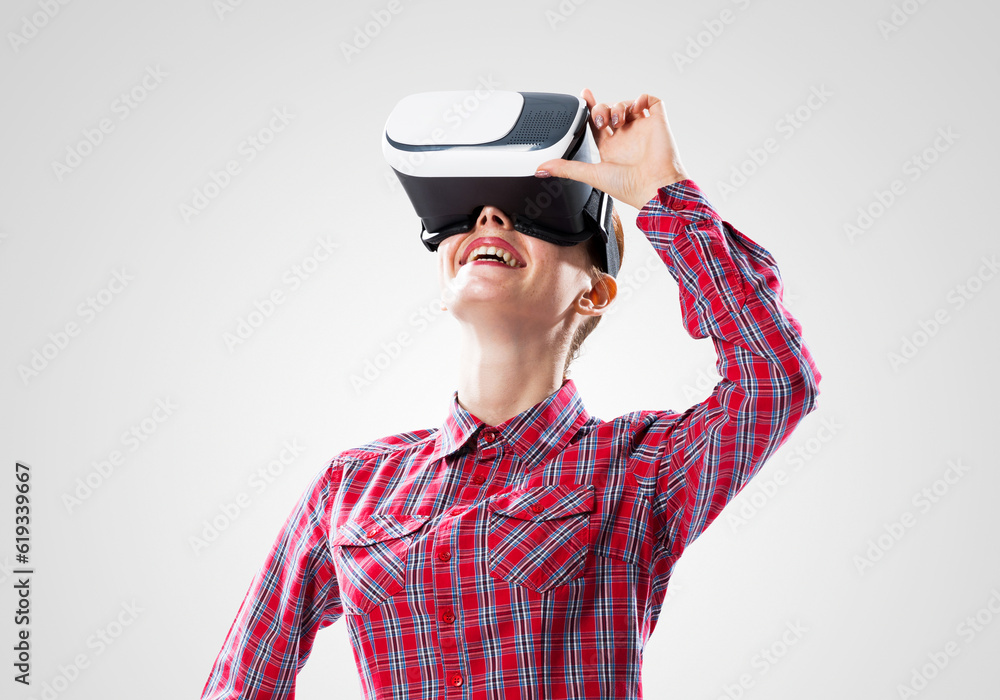 Girl in mask experiencing virtual reality as new entertainment device Girl in mask experiencing virtual reality as new entertainment device