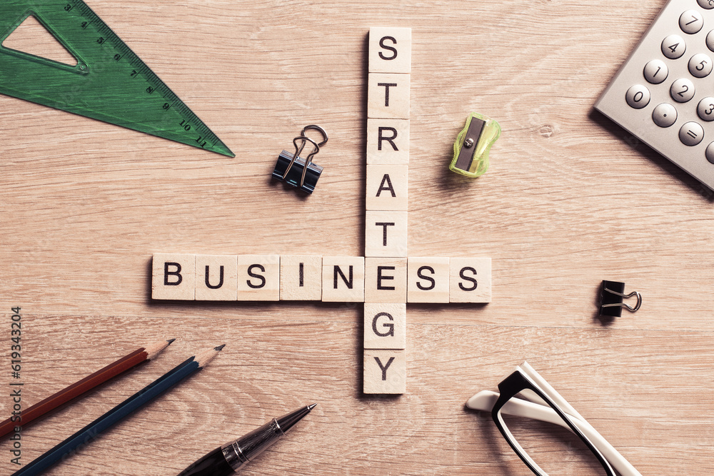 Conceptual business keywords on table with elements of game making crossword Conceptual business keywords on table with elements of game making crossword