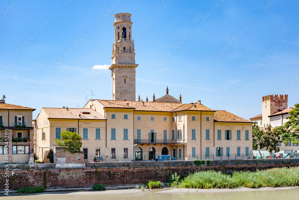 view to cathedral of Verona with river adige and old medieval houses at the riverside,