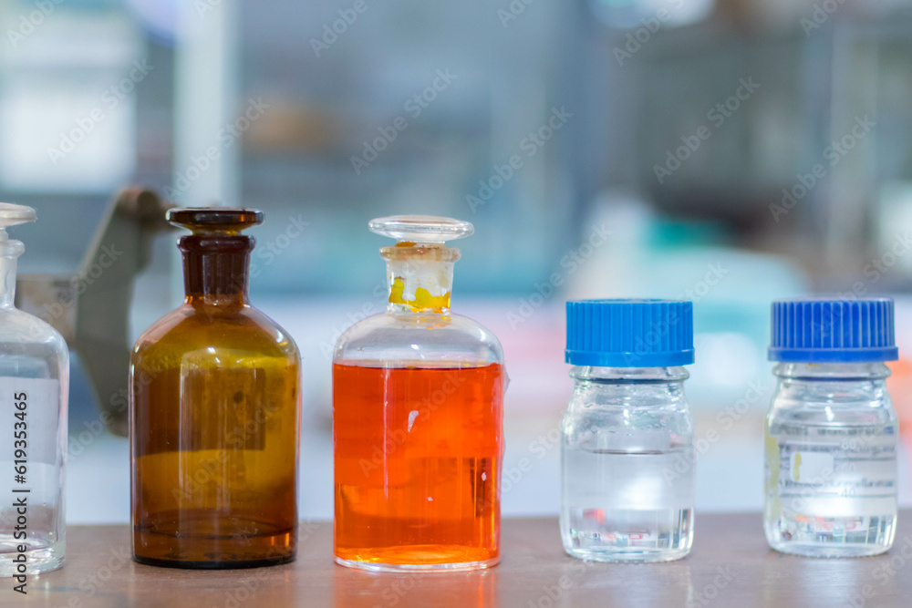 Laboratory glassware with green liquid in a science research laboratory. Laboratory glassware with green liquid in a science research laboratory.