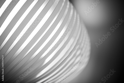 A close-up of a black and white spiral pattern, with striped lines in a perfect circle- an artistic monochrome photograph.