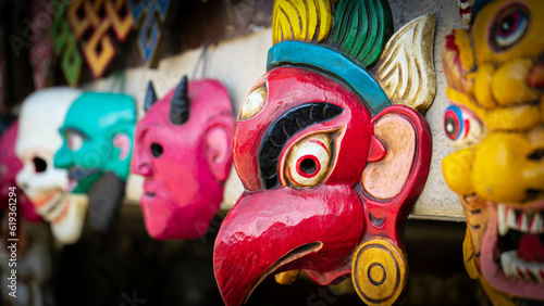 Wallpaper Mural Traditional red mask typical of India and Nepal hanging on a wall as a souvenir for protection, decoration and prosperity Torontodigital.ca