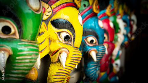 Wallpaper Mural Elephant masks displayed on a wall with different vibrant colors and beautiful perspective typical from Nepal and India Torontodigital.ca