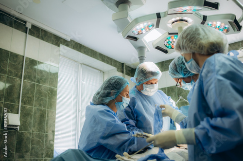 childbirth during cesarean section operation procedure © Roman