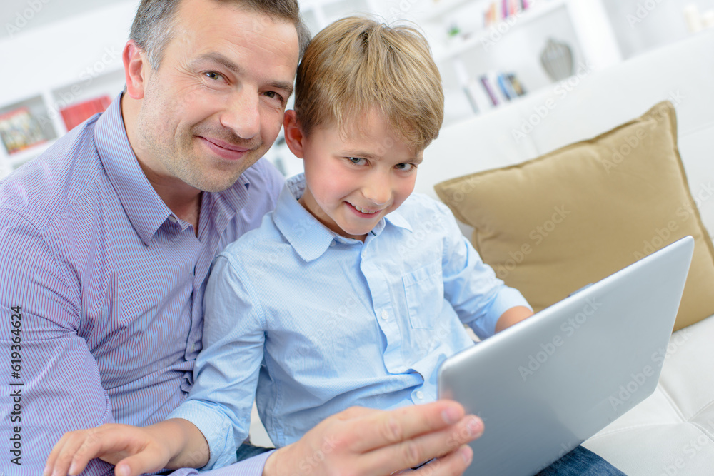 a man and his son with tablet a man and his son with tablet