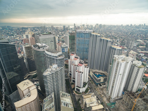 Manila Cityscape, Makati City with Business Buildings and Cloudy Sky. Philippines. Skyscrapers in Background.