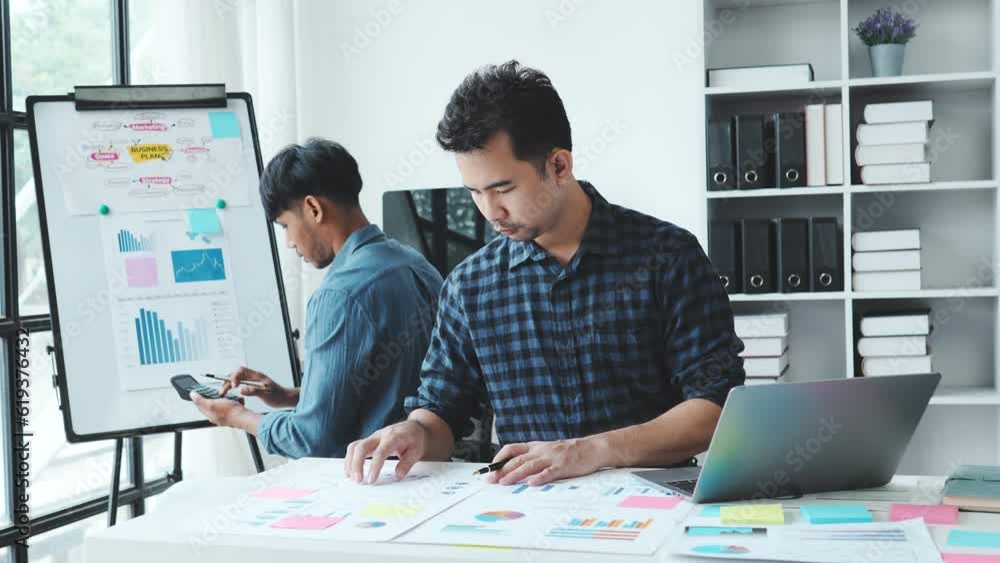 Business team analyzing market research. Business team analyzing market research.