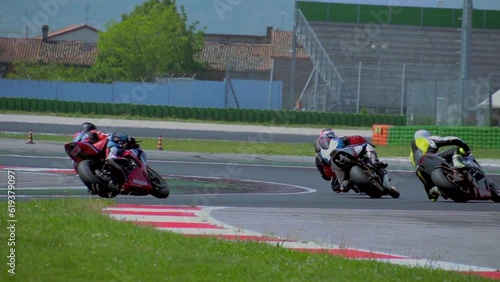driving school. A racing track has been opened, where motorcycle riding trainings are held. Honda moto. A group of motorcyclists. Slow motion. Moto sport Italy Misano  photo