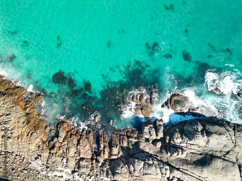 Aerial view of Torpedo Rocks against the sea in Yallingup, Western Australia photo