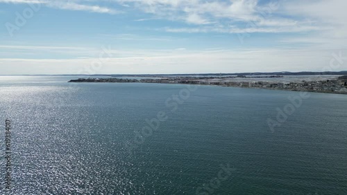 Wallpaper Mural Aerial video of the calm sea and buildings on the shore on a sunny day Torontodigital.ca