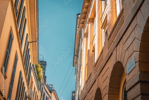 Main Street with Antique Traditional Buildings in the Downtown of Milan ,Italy.Traffic in the Fashion Capital of Italy photo