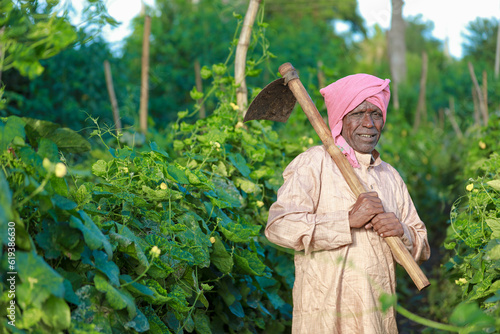 Indian farming happy farmer holding piggy bank in farm, poor farmer, farmer saving