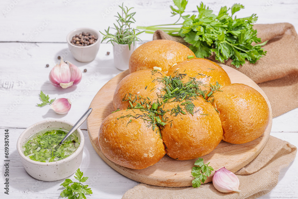 Aromatic garlic buns. Fresh baked goods, a traditional gluten-free soup snack. Parsley, spices