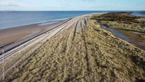 Wallpaper Mural Aerial of a long rocky shore with the blue sea in the background Torontodigital.ca