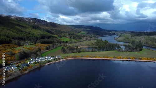 Wallpaper Mural Aerial of a small village on the edge of a calm blue lake with mountains in the background Torontodigital.ca