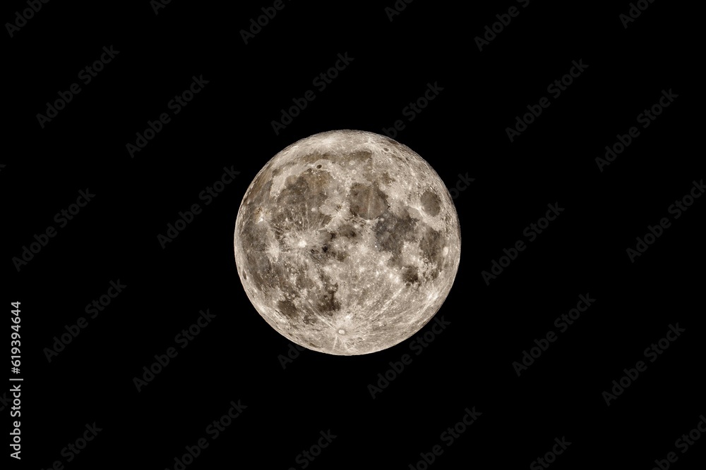 Fototapeta premium Full moon illuminating the night sky