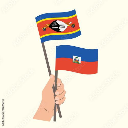 Flags of Eswatini and Haiti, Hand Holding flags