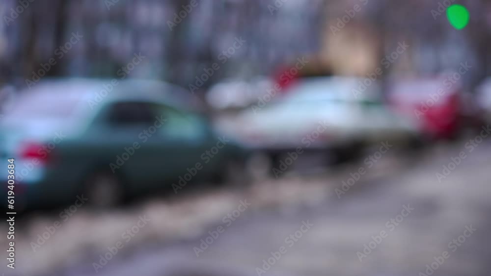 Blurred urban city street with unrecognizable people passing outdoors. Town on cold winter day Blurred urban city street with unrecognizable people passing outdoors. Town on cold winter day