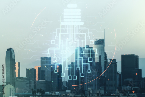 Virtual creative light bulb with chip hologram on Los Angeles office buildings background  artificial Intelligence and neural networks concept. Multiexposure