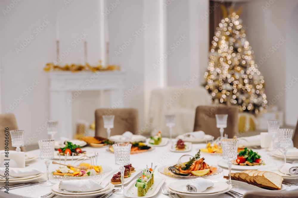 Christmas table setting with delicious dishes.