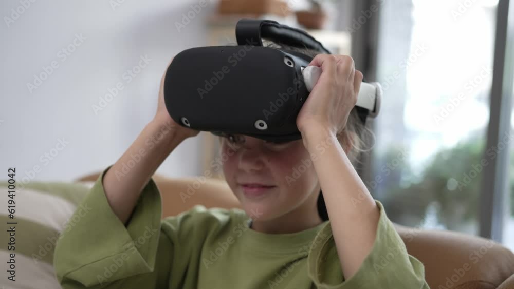 A Little Girl Takes Off her Virtual Reality Helmet A Little Girl Takes Off her Virtual Reality Helmet