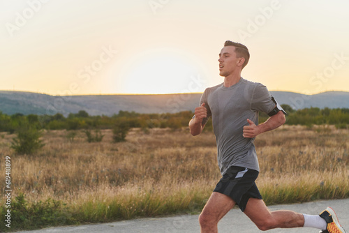 A young handsome man running in the early morning hours, driven by his commitment to health and fitness