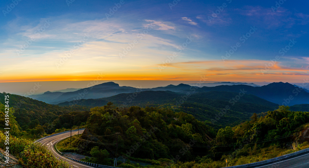 Beautiful panorama landscape of the sunrise viewpoint which is the highest mountain of Thailand in the morning of the winter season at Doi Inthanon National Park, Chiang Mai, Thailand.