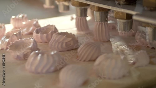dolly slow motion close up shot of the broken marshmallow squeezer. It squeezes out spoiled marshmallows