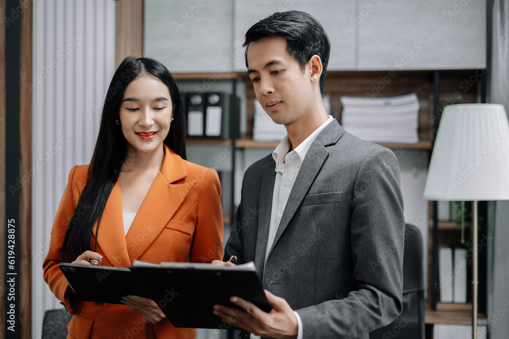Marketing staff team are analyzing the data to business planning at office in the morning. Marketing staff team are analyzing the data to business planning at office in the morning.