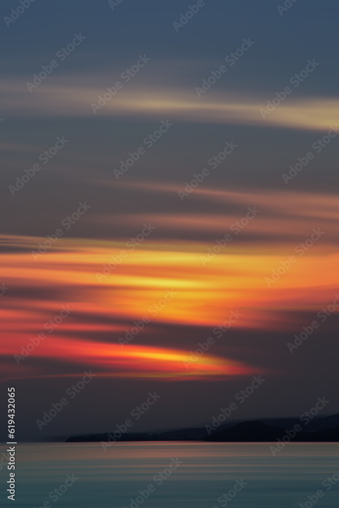 Minimal sunset with beautiful colors, over the Aegean Sea in Greece.