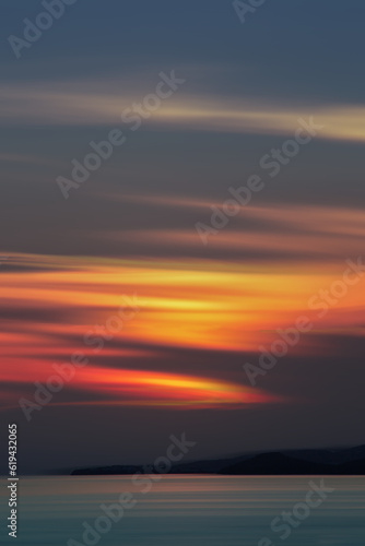 Minimal sunset with beautiful colors, over the Aegean Sea in Greece.
