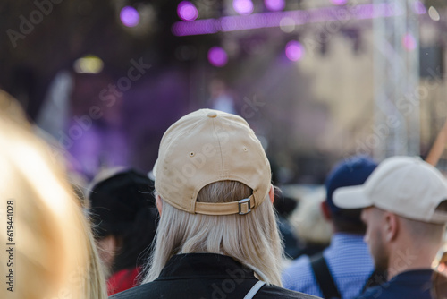 A woman wear a cap At Outdoor celebrates at the Music Festival.