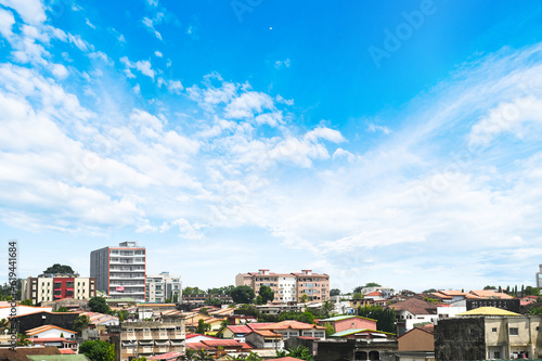 a body of water with a city in the background