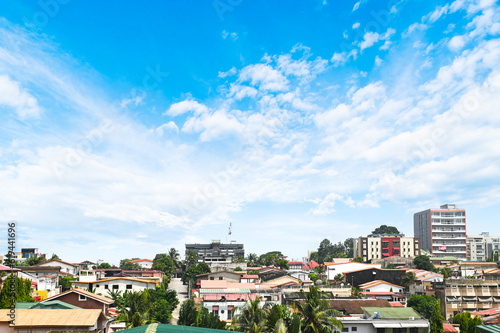 a large body of water with a city in the background