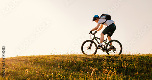Professional mountain bike cyclist riding on white background active lifestyle.