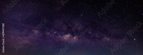 Panorama blue night sky milky way and star on dark background.Universe filled with stars, nebula and galaxy with noise and grain.Photo by long exposure and select white balance.Dark night sky.