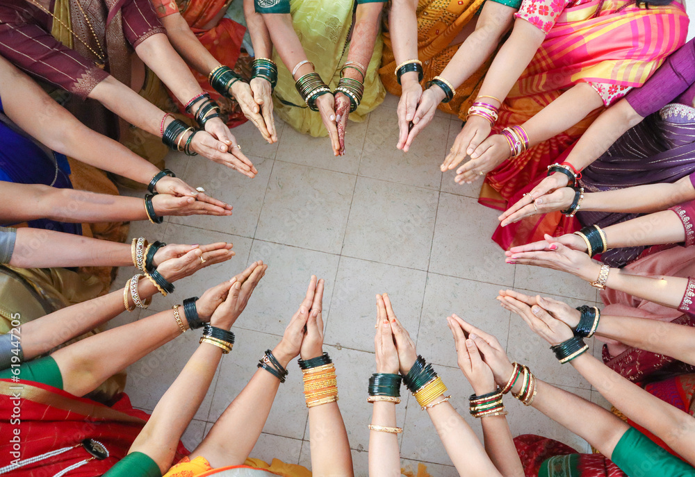 An Elegant picture of a Hindu Wedding ritual where a group of ladies ...