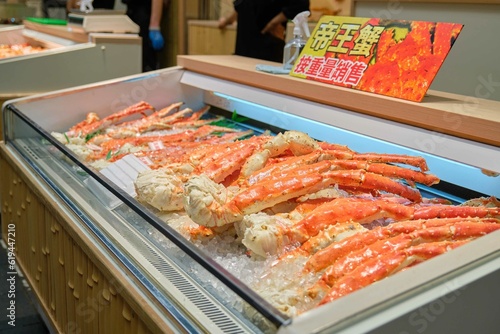 King crab legs on ice selling at market in Osaka, Japan. Street food and travel concepts.