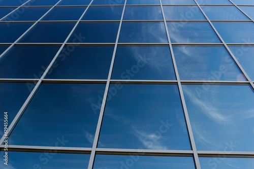Broken blue window in a high-rise building.