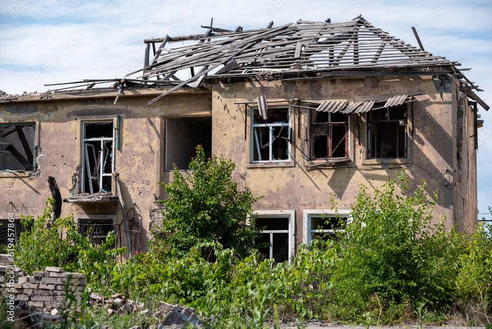 Fototapeta premium destroyed houses in an abandoned city without people in Ukraine
