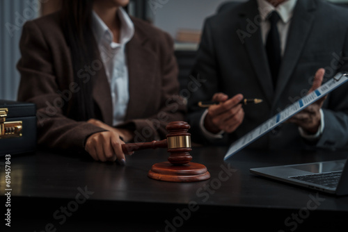 Lawyer explaining legal situation businessperson asian people working in b2b interview, networking or law firm agreement, Infringement of copyright, Embezzlement, Donee, Liquidator, Defunct Company.